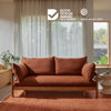 sofa bed in the terracotta colour with the Good Design Award Gold Winner and Red Dot Winner badges at the top